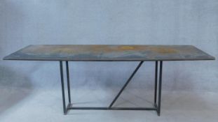 A contemporary metal topped industrial style coffee table on metal tubular base. H.59 W.170 D.60cm