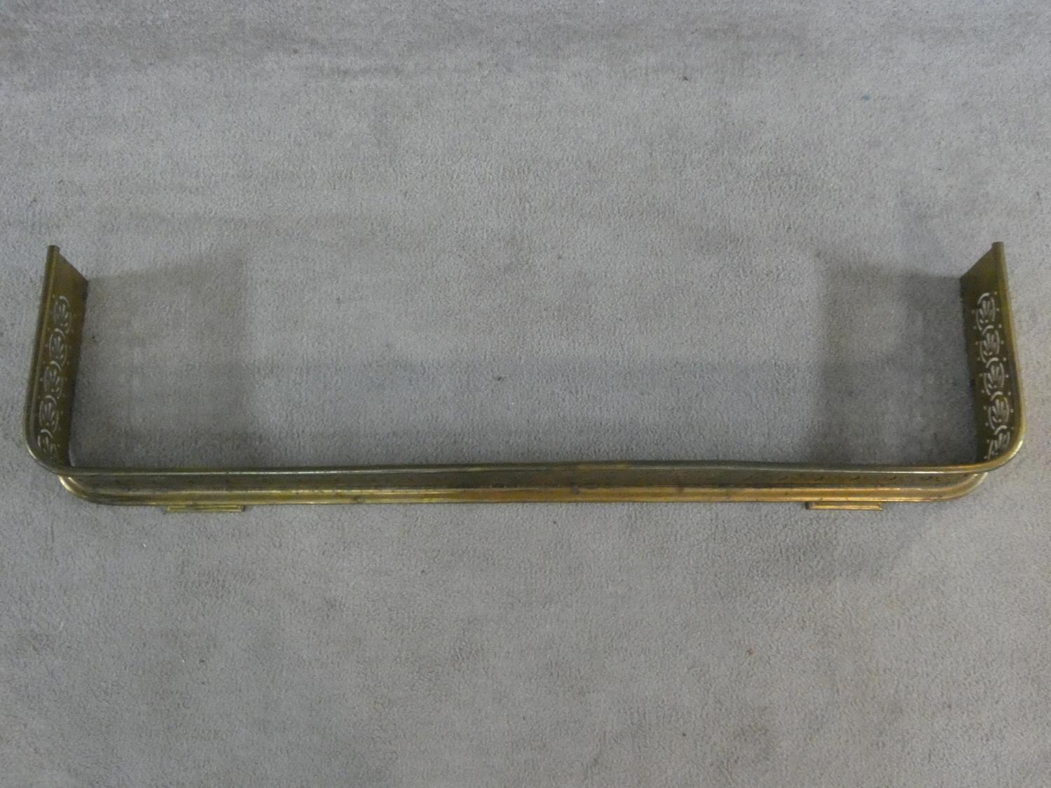 A 19th century pierced brass fire fender resting on stepped bracket feet. H.14xW.118xL.30cm - Image 2 of 5