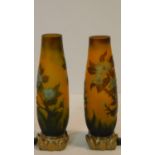 A pair of Galle style cameo glass lamps with floral design on gilded metal floral form bases. H.23cm