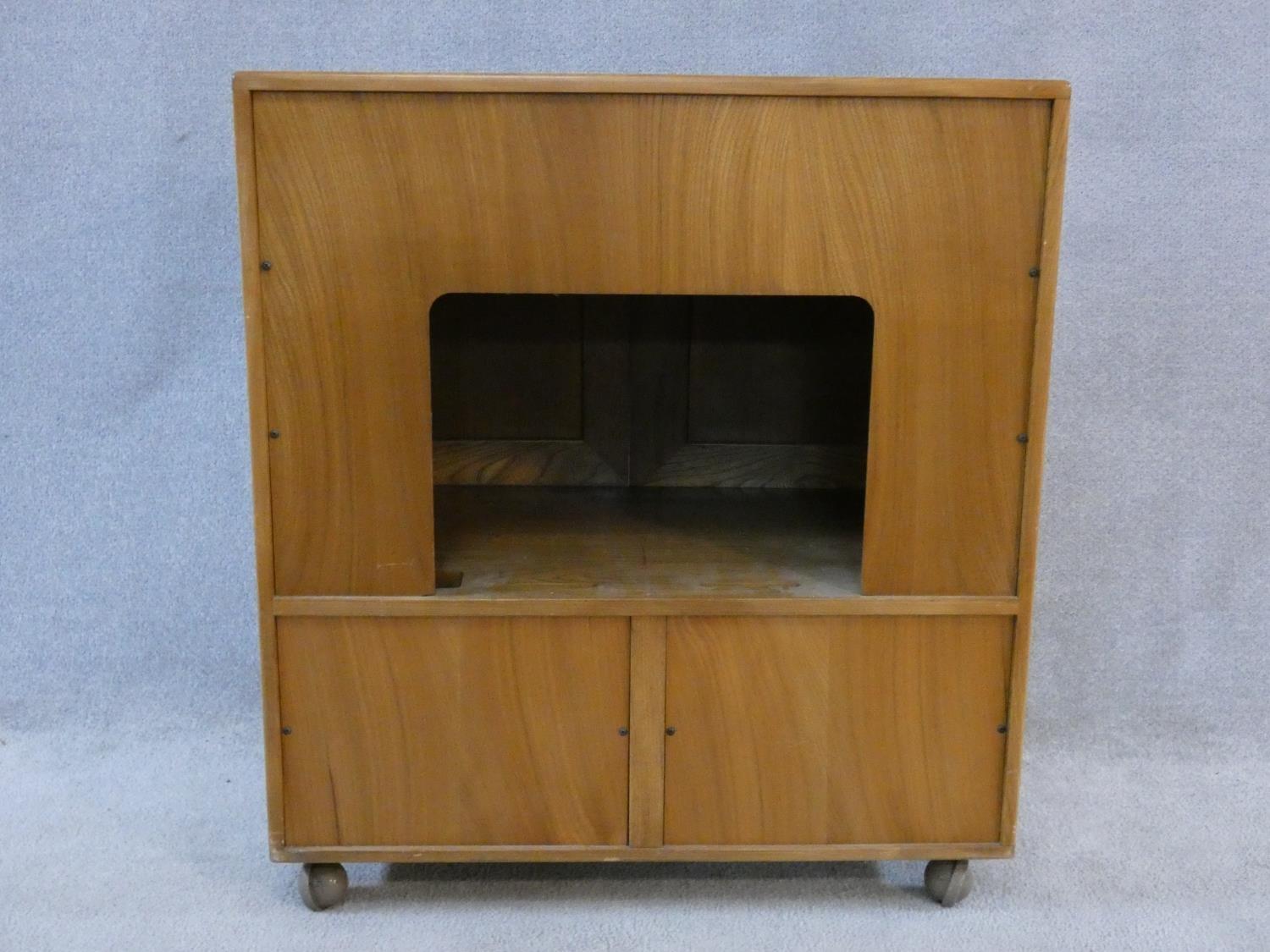 A vintage elm Ercol cabinet with panel doors and drop down base door fitted for HI Fi. H.94xW.85xL. - Image 6 of 13