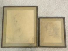 A framed and glazed print of a pencil sketch, portrait of a child and another similar print.