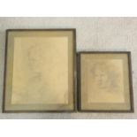 A framed and glazed print of a pencil sketch, portrait of a child and another similar print.