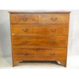 An Edwardian mahogany and satinwood with ebony inlaid chest of two short over three long drawers