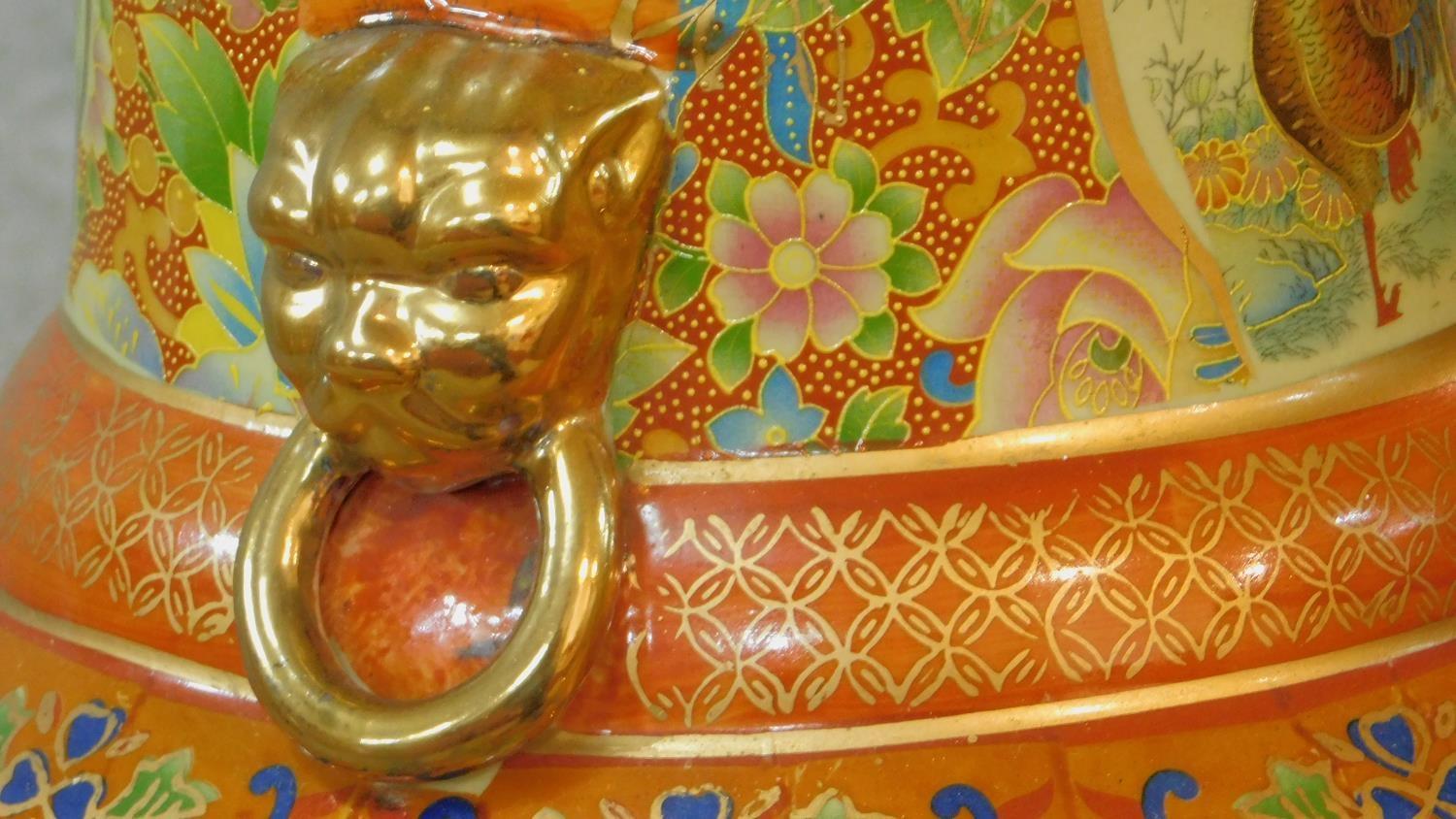 A large ceramic painted and transfer design Oriental vase with gilded lion's head ring handles. - Image 3 of 8