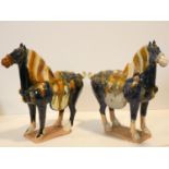 Two Tang style ceramic horse figures in blue and ochre glaze. H.37 W.40 D.14cm