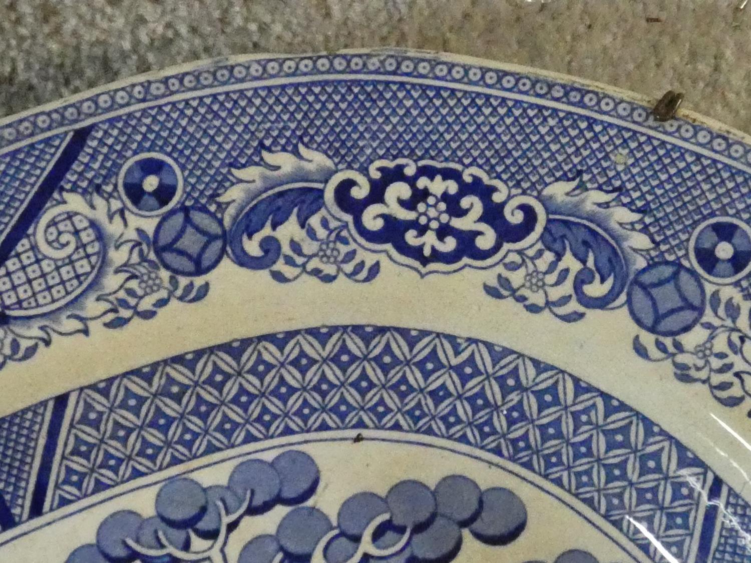 A large antique Staffordshire stoneware blue and white willow pattern transferware design meat - Image 4 of 6