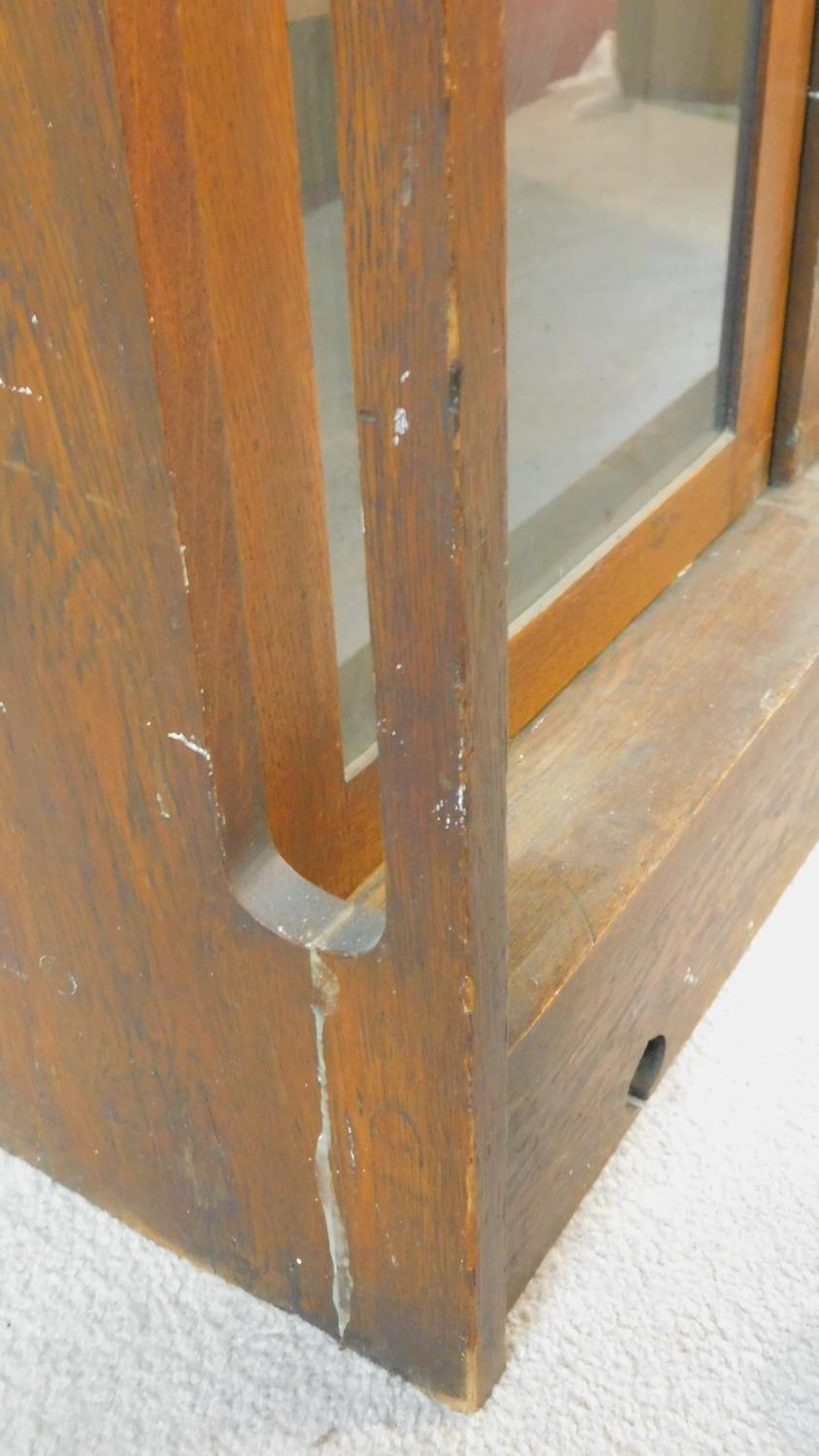 A late 19th century oak Art Nouveau bookcase in the Glasgow School style with leaded glazed - Image 8 of 8