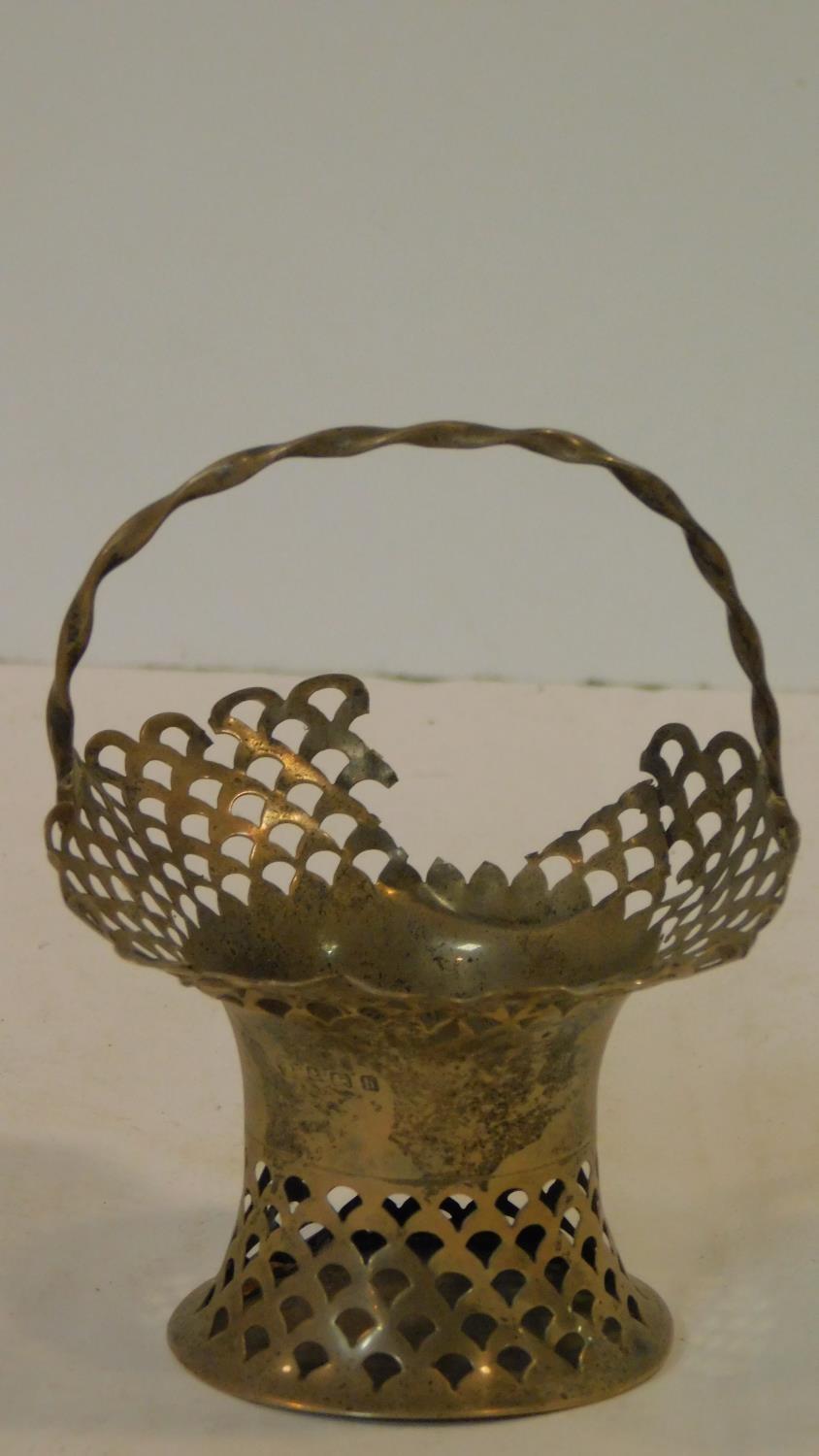A Victorian silver pierced posy basket with twisted handle. Birmingham 1907. H.12cm
