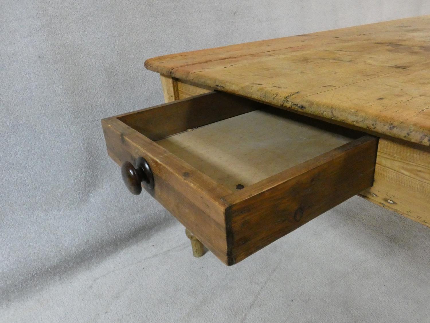 A Victorian pine kitchen dining table with planked top and end drawer on turned tapering supports. - Image 8 of 16