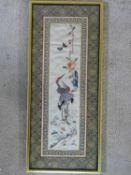 A framed and glazed Chinese panel, storks and foliate decoration within a stylized flowerhead