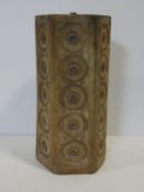 A vintage mid century lamp base of hexagonal section with impressed medallions to each side in a