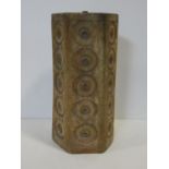 A vintage mid century lamp base of hexagonal section with impressed medallions to each side in a