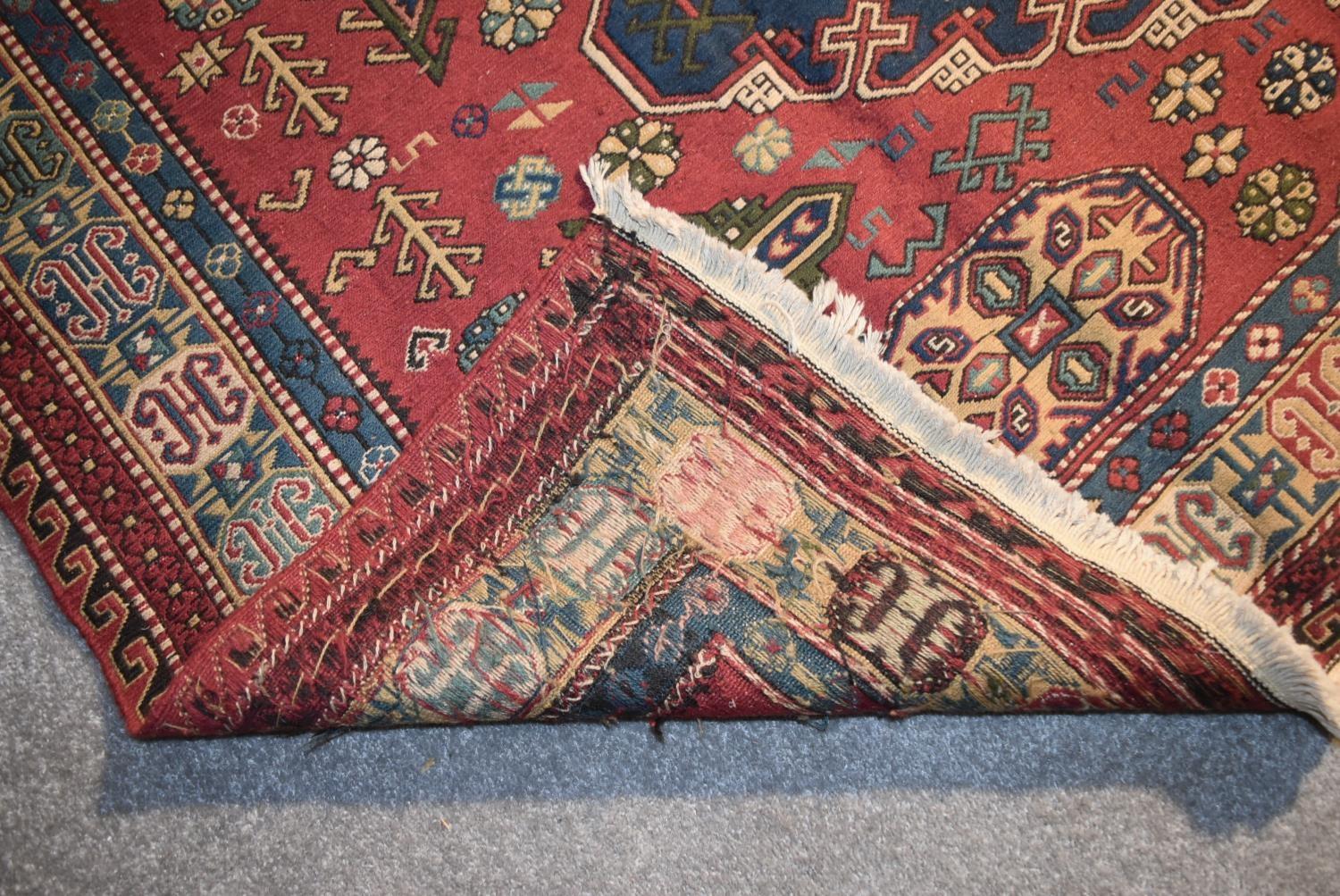 A Sumak Kilim with repeating pendant medallions on maroon ground surrounded by stylised floral and - Image 4 of 4