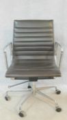 A vintage Charles and Ray Eames inspired Aluminium Group style office desk armchair in black