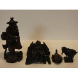 A collection of Chinese figures and masks. Including a resin wood effect mask, a carved wooden