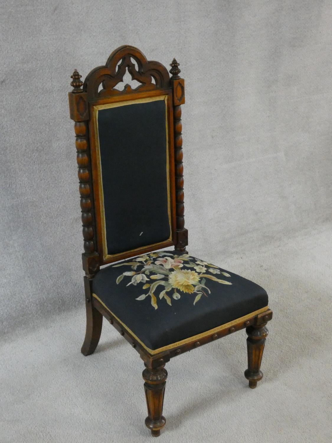 A late Victorian walnut Gothic carved prie dieu style side chair in floral tapestry upholstery. H. - Image 2 of 6