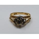 A vintage diamond and 9ct yellow gold floral cluster ring, set with seven round brilliant cut