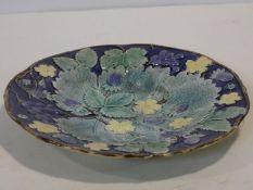 A Swedish Rorstrand Majolica plate with raised strawberry, grape and floral decoration, marked to