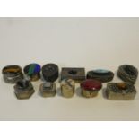 A miscellaneous collection of eleven miniature lidded cases and pill boxes to include, white metal