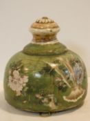 A 19th century Japanese Satsuma style hanging jardiniere in green glaze decorated all over with