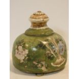 A 19th century Japanese Satsuma style hanging jardiniere in green glaze decorated all over with