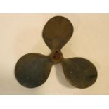 A vintage solid brass three blade boat propellor. 23x23cm