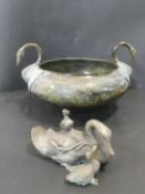 A patinated brass urn with two swan head handles and hammered design bowl along with a Japanese