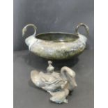 A patinated brass urn with two swan head handles and hammered design bowl along with a Japanese