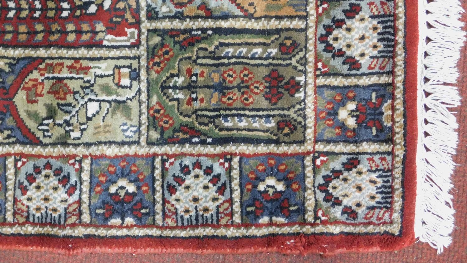 A Bachtiar rug with central pole medallion on burgundy ground within floral panels. 62x112cm - Image 3 of 4