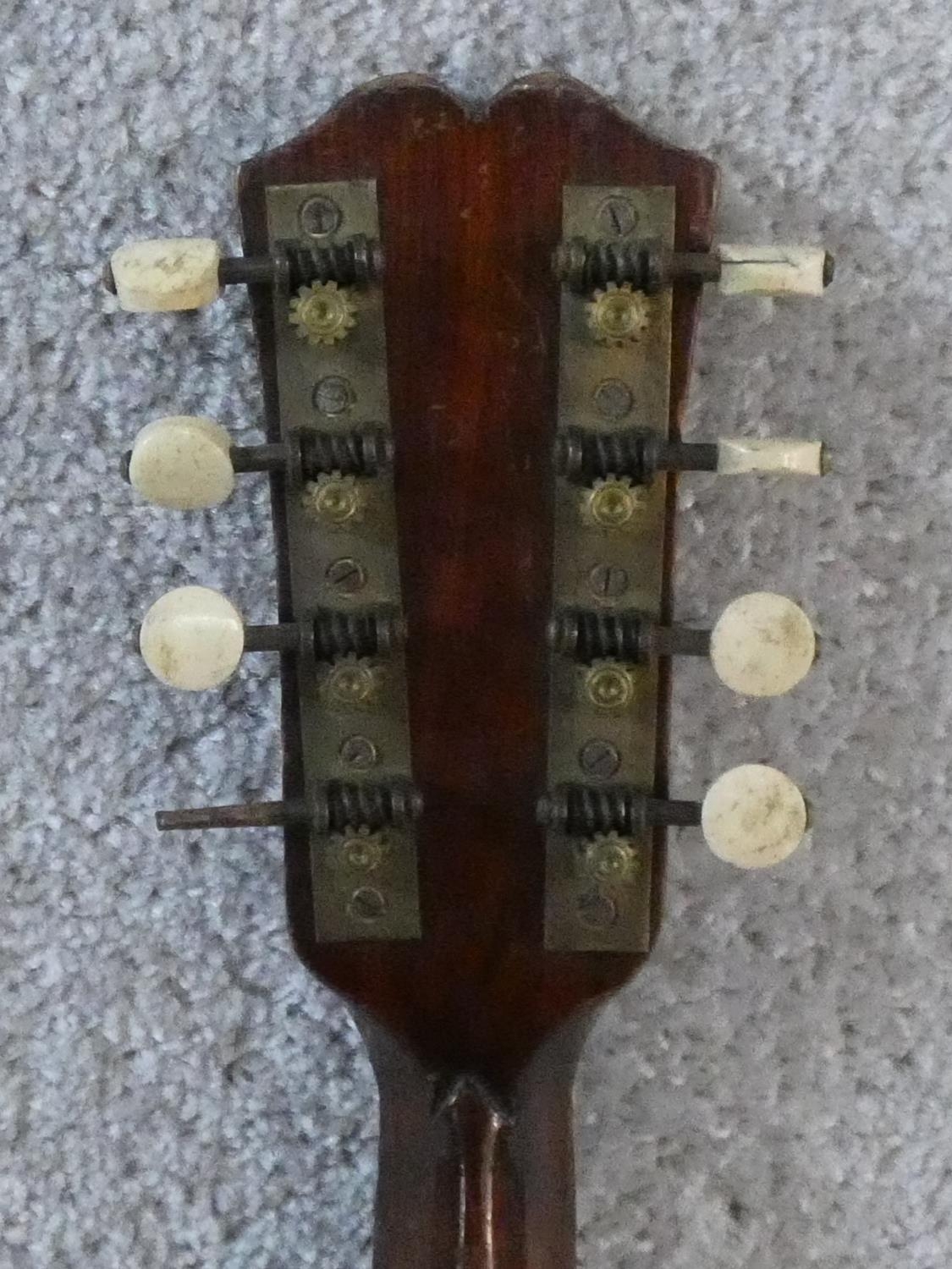 An early 20th century mandolin with mother of pearl and tortoiseshell inlay, signed Ozelli and - Image 6 of 13