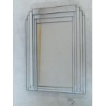 An Art Deco style overmantel mirror in glass panelled frame. 104x93cm