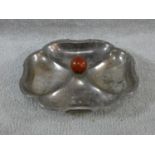 An Art Deco silver plated quatrefoil shaped sectional serving dish with central bakelite handle. H.