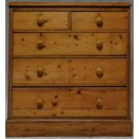 A Victorian pine chest of two short above three long drawers on plinth base. H.98 W.94 D.42cm