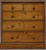 A Victorian pine chest of two short above three long drawers on plinth base. H.98 W.94 D.42cm