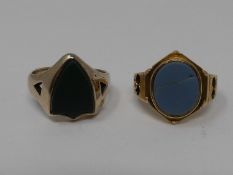 Two stone set signet rings. One yellow metal with an oval agate cartouche, engraved and pierced