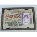 A framed vintage Coca Cola advertising mirror. 99x68cm