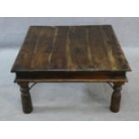 An Indian iron bound hardwood low table on circular section supports. H.42xW.80xL.80cm