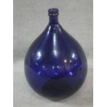 A Pols Potten Danish dark blue glass demijohn. H.55cm