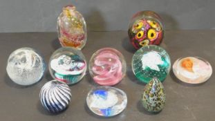 A miscellaneous collection of ten Art Glass paperweights to include signed, Isle if Wight, Caithness