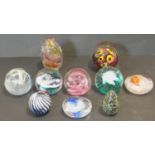 A miscellaneous collection of ten Art Glass paperweights to include signed, Isle if Wight, Caithness