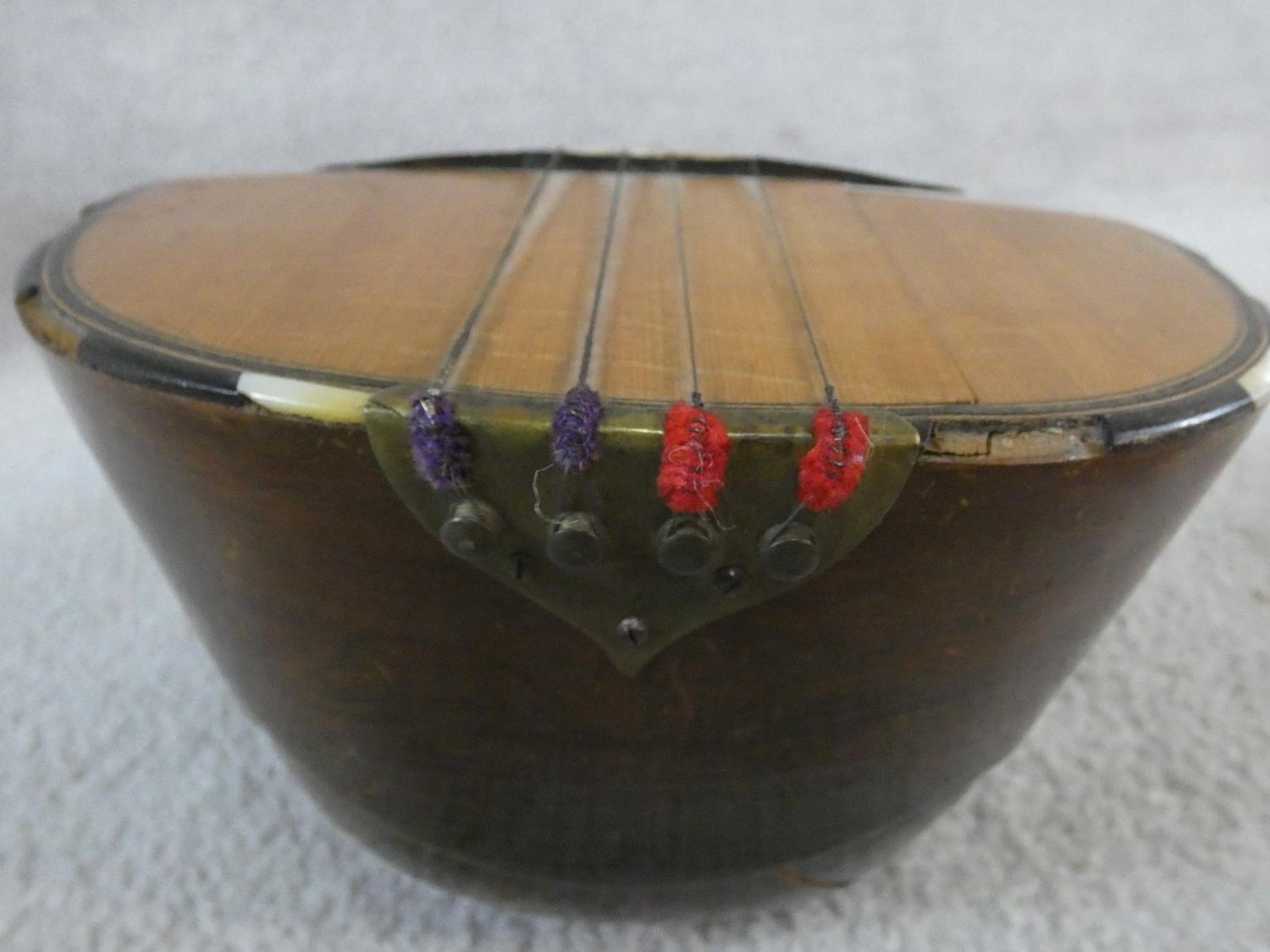 An early 20th century mandolin with mother of pearl and tortoiseshell inlay, signed Ozelli and - Image 9 of 13