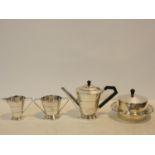 An Art Deco silver plated four piece coffee set comprising coffee pot, cream jug, sugar bowl and