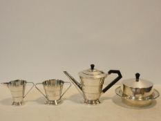 An Art Deco silver plated four piece coffee set comprising coffee pot, cream jug, sugar bowl and