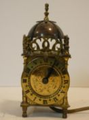 A mid century 17th century style brass lantern clock by Smiths Electrics. H.18cm (wired but not