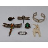 A collection of vintage jewellery. Including two dragonfly brooches, an antique ivory gazelle