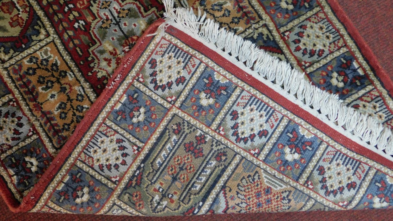 A Bachtiar rug with central pole medallion on burgundy ground within floral panels. 62x112cm - Image 4 of 4