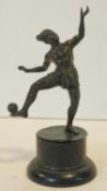 An antique bronze of a Sipa player on an ebonised wooden base. Intricately detailed. H.21cm
