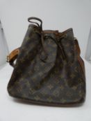 A Louis Vuitton style, Sac Noe bag with tan leather handle and drawstring closure. H.26cm