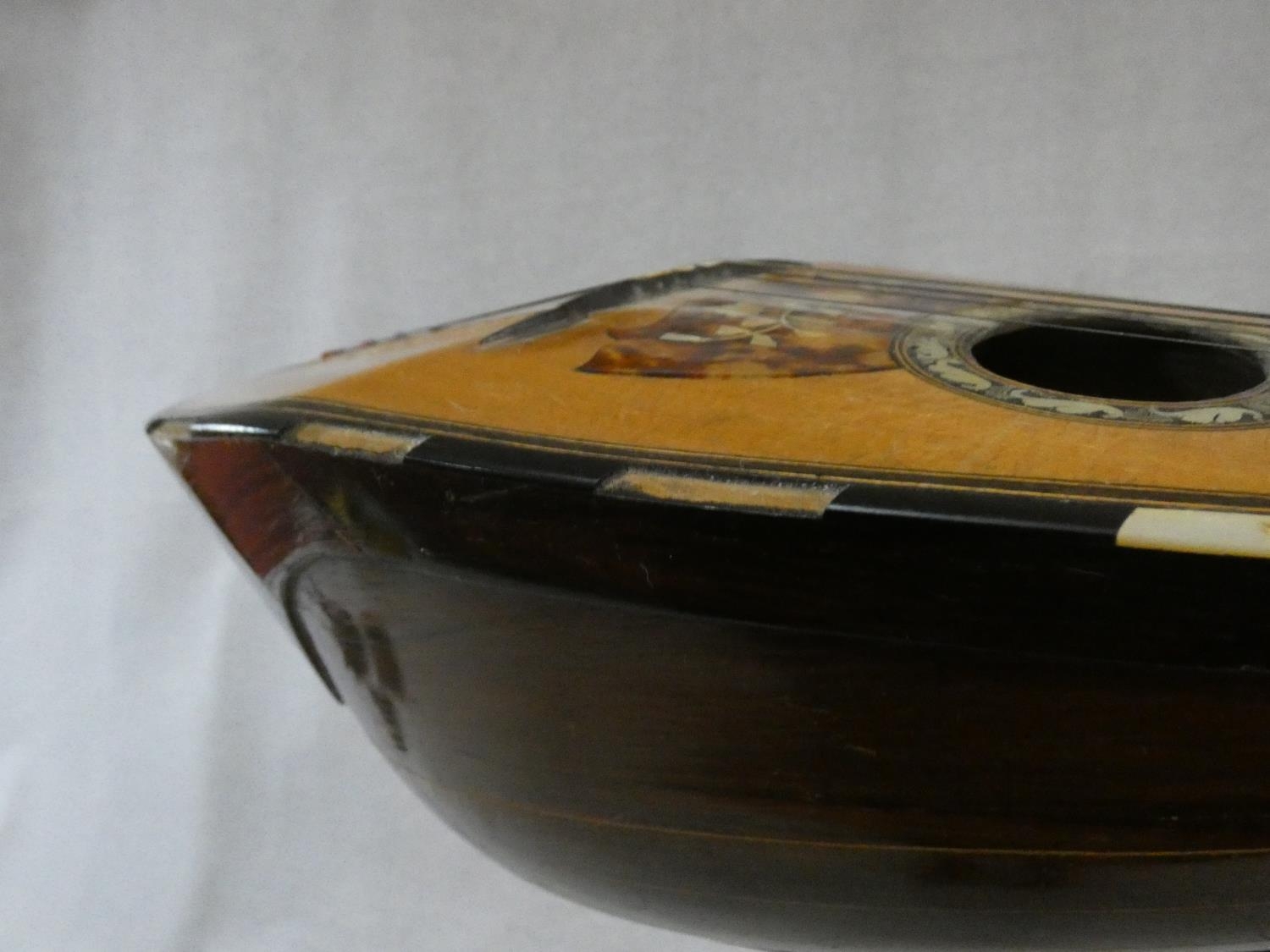 An early 20th century mandolin with mother of pearl and tortoiseshell inlay, signed Ozelli and - Image 12 of 13