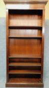 An Edwardian style mahogany floor standing open library bookcase with dentil cornice and satinwood